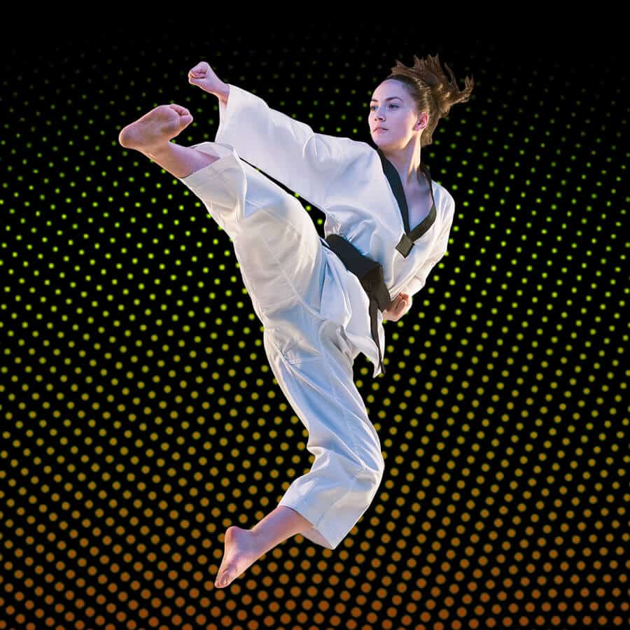 Martial Arts Lessons for Adults in Taylor TX - Girl Black Belt Jumping High Kick